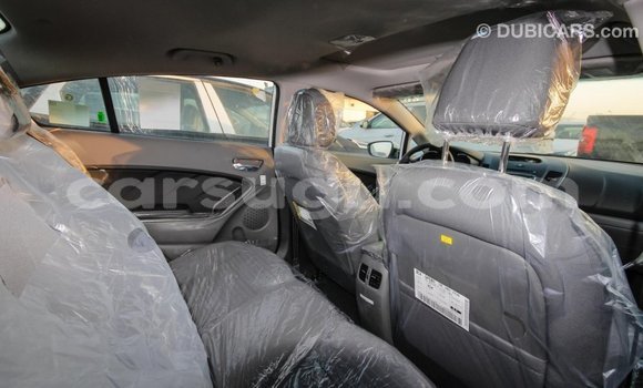 Sayi Imported Kia Cerato White Mota in Import - Dubai a Burkina Faso Sayi Imported Kia Cerato White Mota in Import - Dubai a Burkina Faso