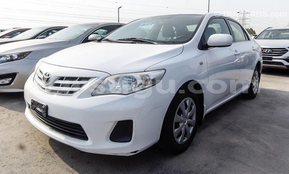 Sayi Imported Toyota Corolla White Mota in Import - Dubai a Burkina Faso Sayi Imported Toyota Corolla White Mota in Import - Dubai a Burkina Faso