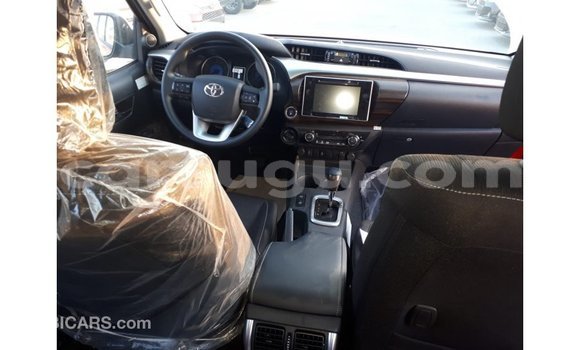 Sayi Imported Toyota Hilux Red Mota in Import - Dubai a Burkina Faso Sayi Imported Toyota Hilux Red Mota in Import - Dubai a Burkina Faso