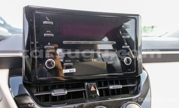 Sayi Imported Toyota Corolla White Mota in Import - Dubai a Burkina Faso Sayi Imported Toyota Corolla White Mota in Import - Dubai a Burkina Faso