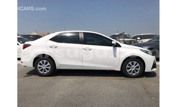 Sayi Imported Toyota Corolla White Mota in Import - Dubai a Burkina Faso Sayi Imported Toyota Corolla White Mota in Import - Dubai a Burkina Faso