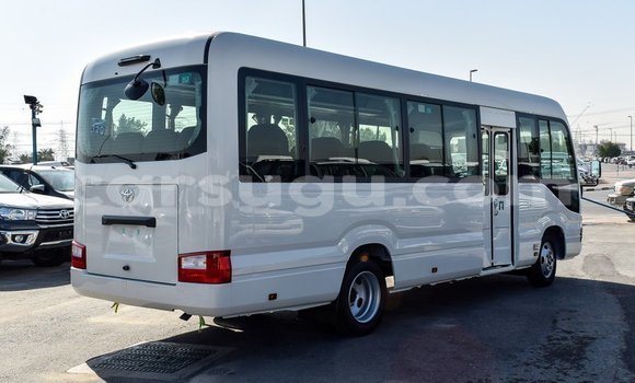 Acheter Import Voiture Toyota Coaster Blanc à Import - Dubai, Burkina-Faso Acheter Import Voiture Toyota Coaster Blanc à Import - Dubai, Burkina-Faso