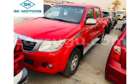 Sayi Imported Toyota Hilux Red Mota in Import - Dubai a Burkina Faso
