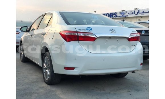 Sayi Imported Toyota Corolla White Mota in Import - Dubai a Burkina Faso Sayi Imported Toyota Corolla White Mota in Import - Dubai a Burkina Faso