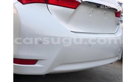 Sayi Imported Toyota Corolla White Mota in Import - Dubai a Burkina Faso Sayi Imported Toyota Corolla White Mota in Import - Dubai a Burkina Faso