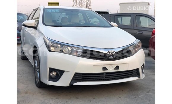 Sayi Imported Toyota Corolla White Mota in Import - Dubai a Burkina Faso Sayi Imported Toyota Corolla White Mota in Import - Dubai a Burkina Faso